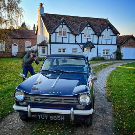 Cameraman films Triumph Herald
