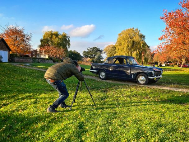 Cameraman filming Triumph Herald